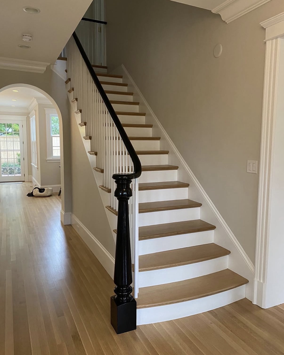 Elegant stair finish with oak treads and painted risers